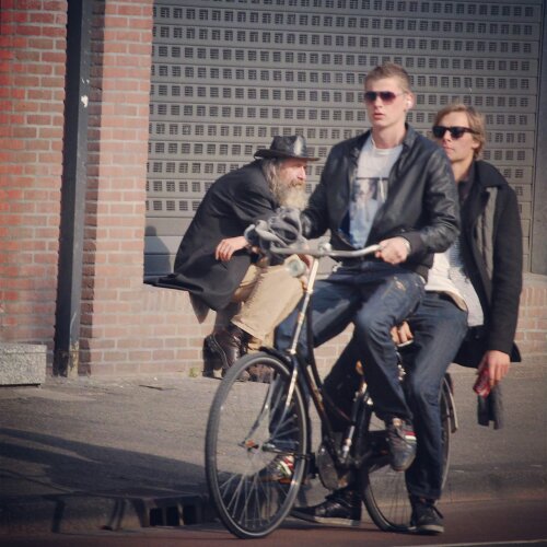 two people riding one bike